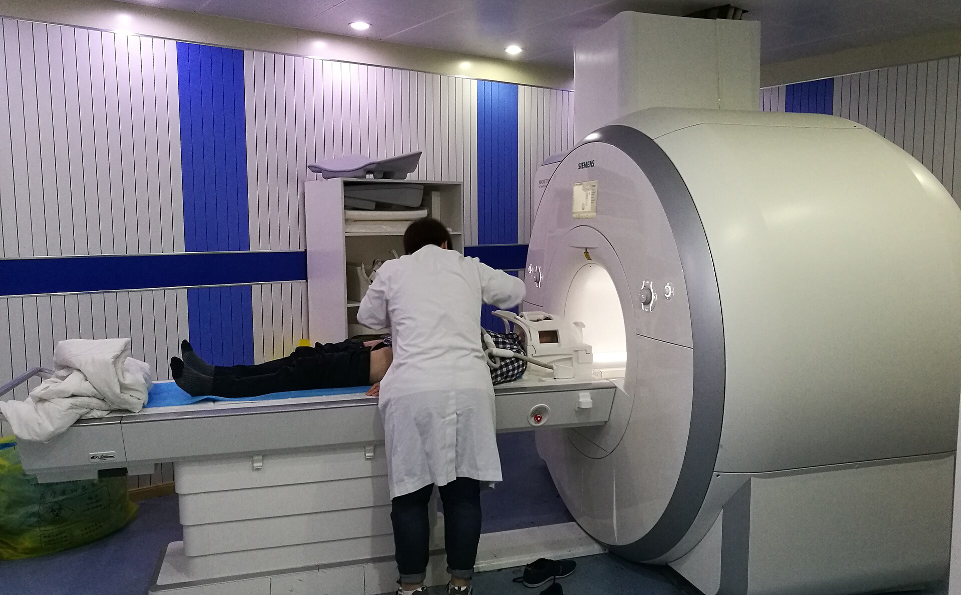 A patient being positioned in an MRI scanner
